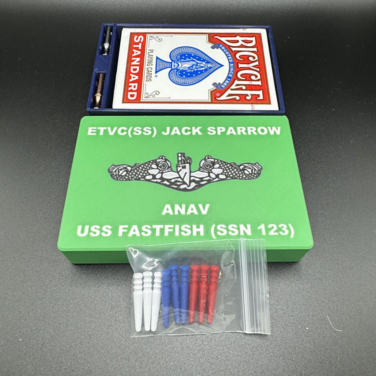 Open Pocket Cribbage case showing the deck of cards and pegs stored inside